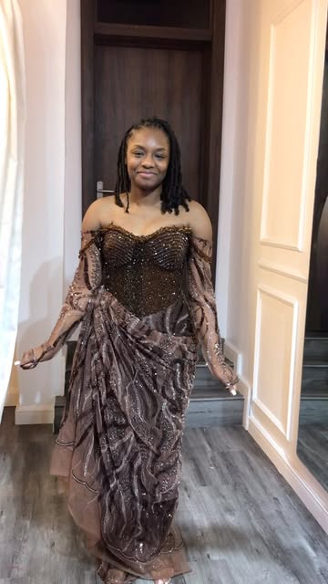 Chocolate beaded gown with sheer sleeves